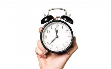 hand-man-holding-vintage-clock-1-1-1024x809